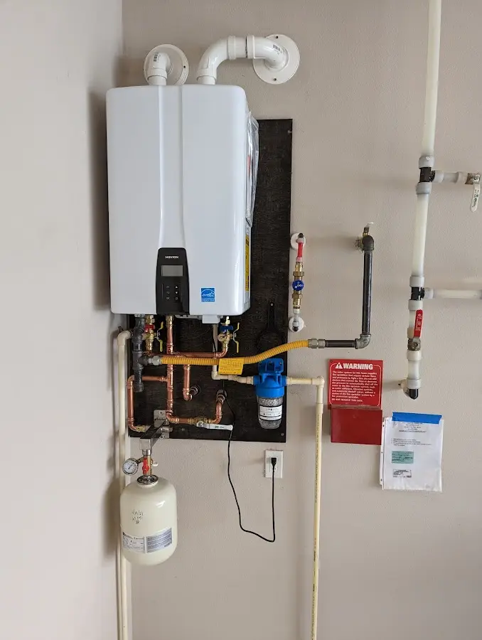 Professional plumber installing copper piping in a West Rancho Dominguez home